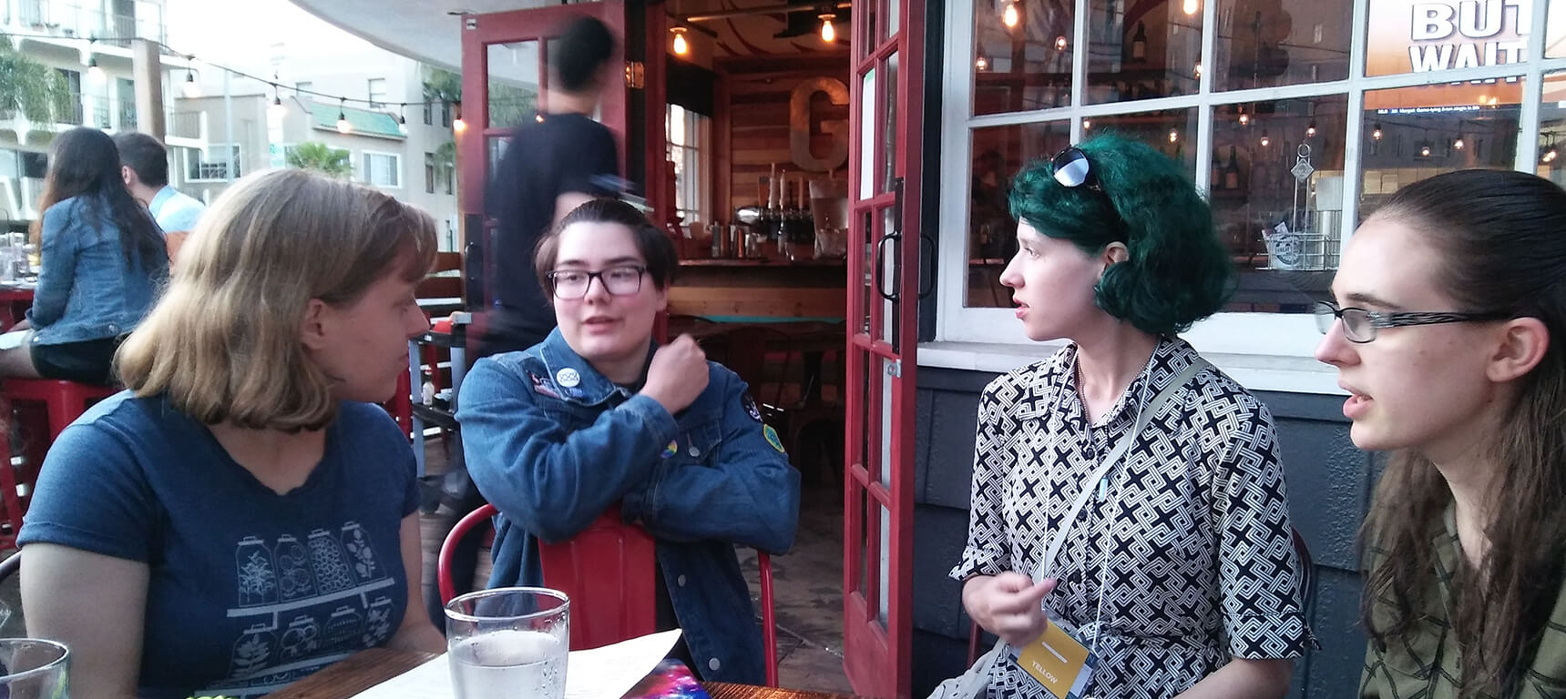 Four cousins talking at the after-con party